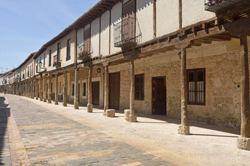 Fototapeta premium Street with arcades in Ampudia, Tierra de Campos, Palenciia province, Castilla y Leon, Spain