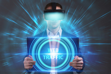 Business, Technology, Internet and network concept. Young businessman working in virtual reality glasses sees the inscription: Web traffic