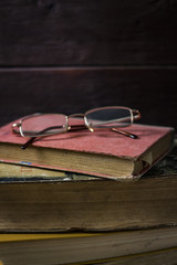 Beautifully folded old books and glasses from above