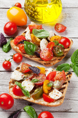 Bruschetta with tomatoes, mozzarella and basil