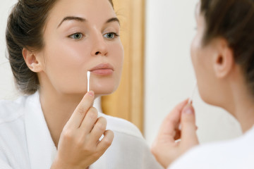 Woman with a cotton swab