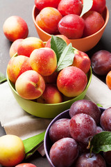 Fresh ripe peaches and plums