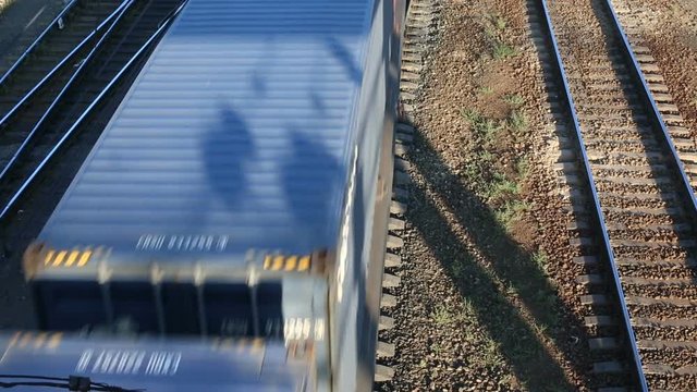 Freight train passing by at sunset