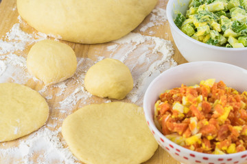 Ingredients for pie bites with egg and vegetable filling.