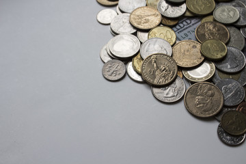 Beautiful image of coins of different countries on a white background under natural light. Can be used as a postcard