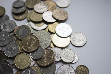 Beautiful image of coins of different countries on a white background.