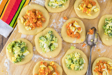 Ingredients for pie bites with egg and vegetable filling.