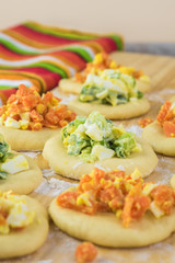 Ingredients for pie bites with egg and vegetable filling.