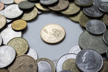 The US coin is surrounded by coins from around the world. Beautiful composition