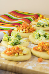 Ingredients for pie bites with egg and vegetable filling.
