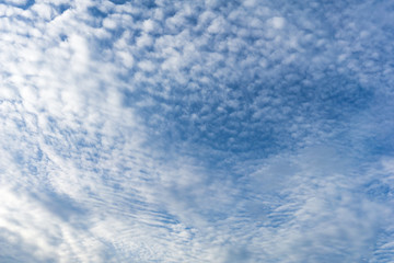 Strange clouds, blue sky