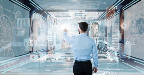 Businessman touching and interacting with technology interface