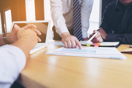 Business team meeting to consider business performance.