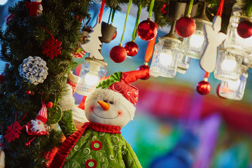 Christmas decorations and glass lanterns on a Parisian Christmas market
