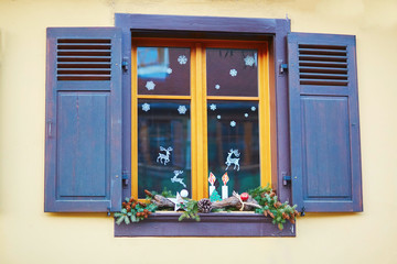 Window decorated for Christmas in French or German town