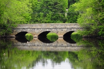 Fototapeta na wymiar Stone bridge over the Concord River