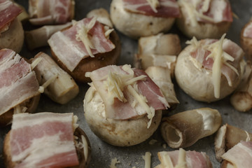Mushrooms for baking in a frying pan, with cheese and bacon, champignons. Restaurant Shot