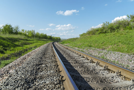 railroad close-up to horizon in green landscape