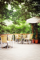 Wicker chairs. Cafe in the street.