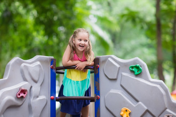 Child on school playground. Kids play.