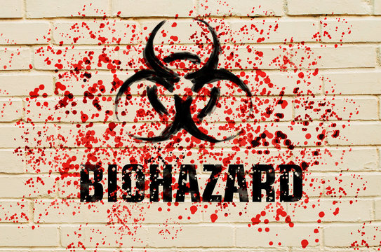 Biohazard sign on the wall with red toxic sprays on the wall
