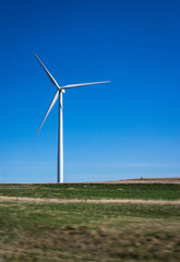 Fototapeta premium Vertical image of a single wind turbine.