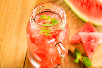 Fototapeta na wymiar Detox water with slices of watermelon in a glass jar.