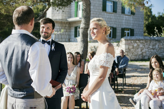 Bride and groom at  wedding ceremony on beach