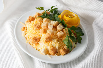 cesar salad with greens on a white plate