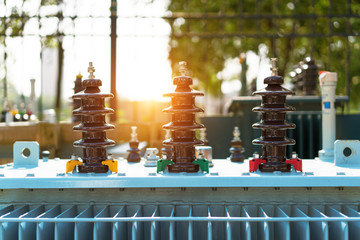 High voltage transformer with electrical insulation and electrical equipment in power substation.