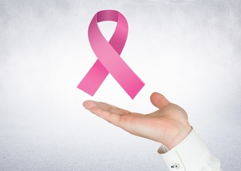 Open hand with pink ribbon for breast cancer awareness - Powered by Adobe