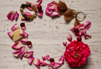 Circle made of petals and pink accessories