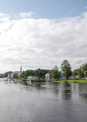 A quiet harbor. Summer view of the embankment overlooking the park.