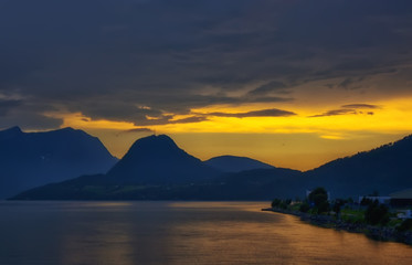 beautiful and dramatic Norway landscape with mountains and sea in fjord