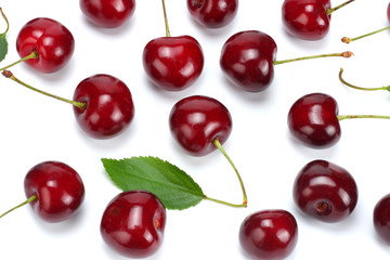 cherry with green leaf isolated on white background.