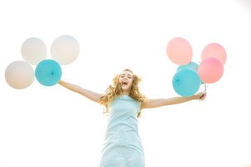  beautiful woman with flying multicolored balloons 