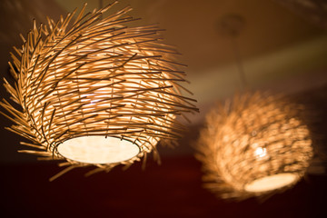 classic lamp made from farmer's bamboo hat hanging on ceiling