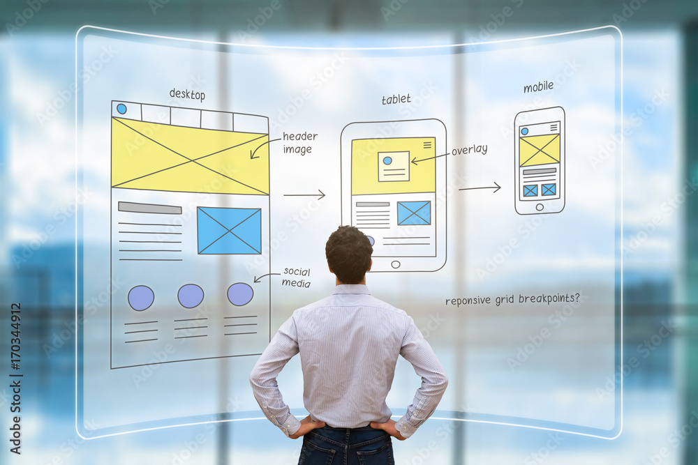 Poster website front end designer reviewing wireframe layout mockup, ar screen