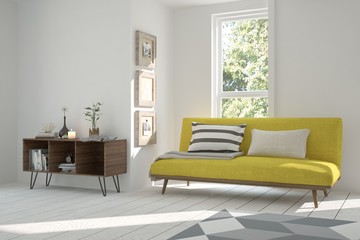 Fototapeta premium Idea of white room with sofa and summer landscape in window. Scandinavian interior design. 3D illustration