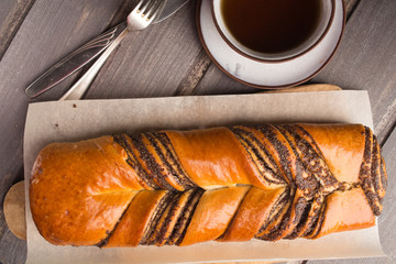 Poppy roll on wooden board