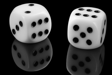 White Dice On Black Background with reflection