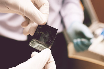 The investigator takes fingerprints from the suspect in the crime. Investigation is a crime. Crime.