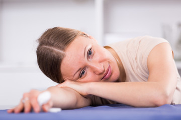 Upset woman sitting at table