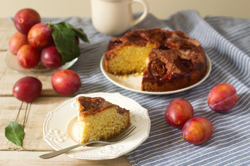 Plum pie or cake with cinnamon and sugar. Plum cake from the newspaper New York Times . Selective focus.