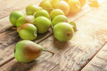 Ripe pears on wooden background