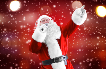 Santa Claus singing songs on color background. Christmas and New Year music