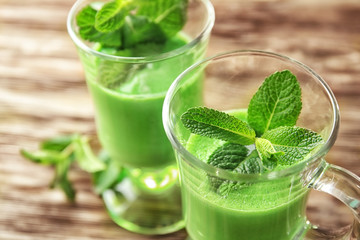 Glasses of green healthy juice with mint, closeup