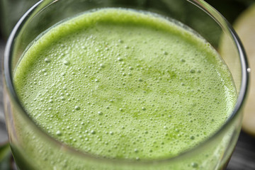 Glass of green healthy juice, closeup