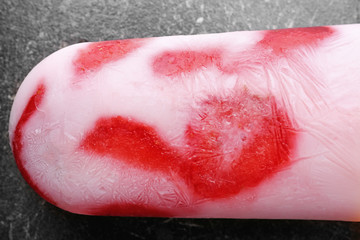 Tasty yogurt ice cream with strawberry on table, closeup