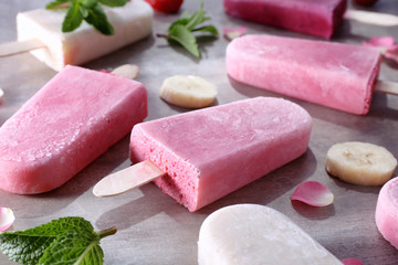 Tasty yogurt ice cream on table